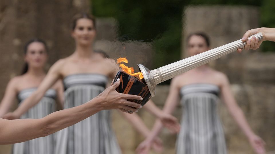 Paris Olympics flame lit at Ancient Olympia despite weather issues