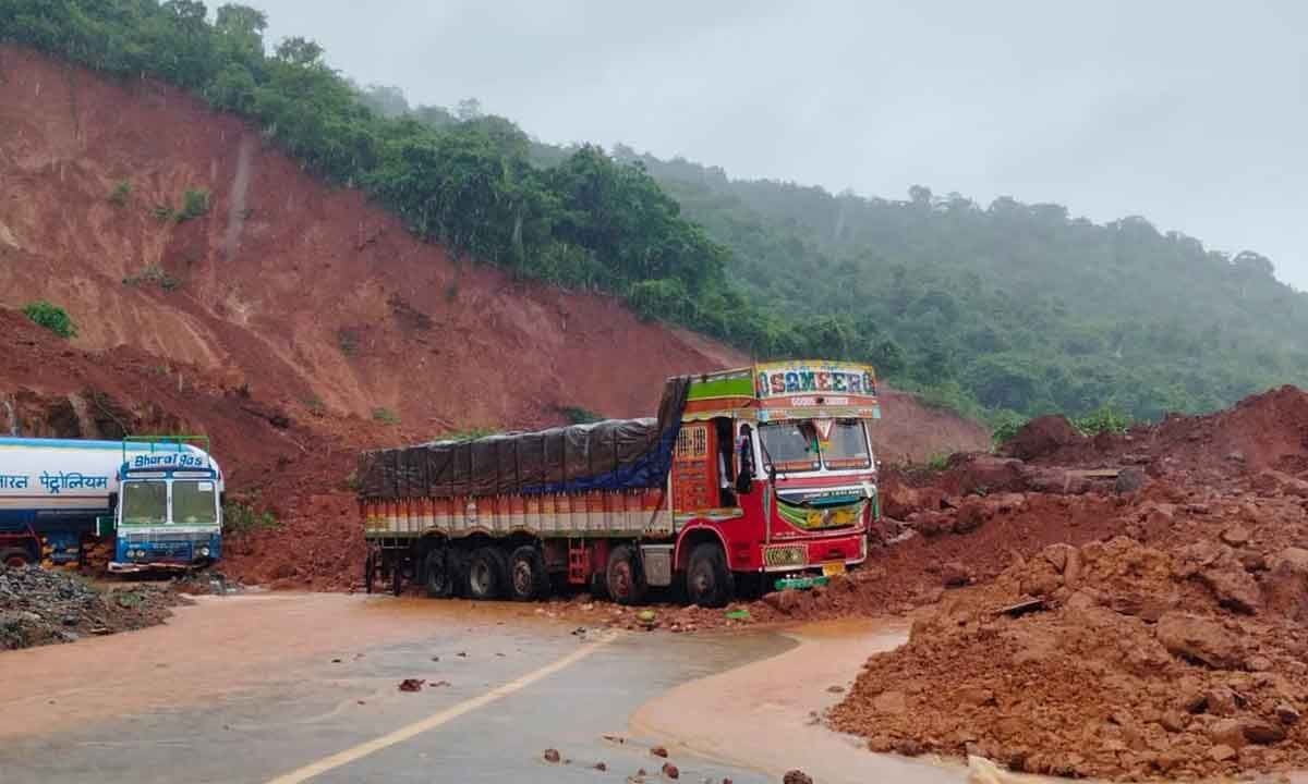 Truck still trapped under mud with driver inside the cabin