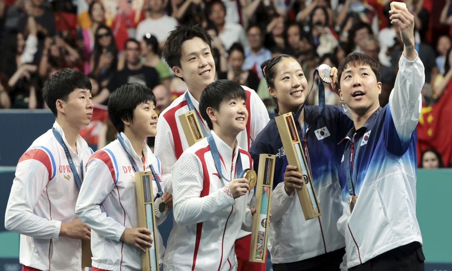 Why Korean Table Tennis Players’ Selfie is Regarded as a Glimpse of Unity